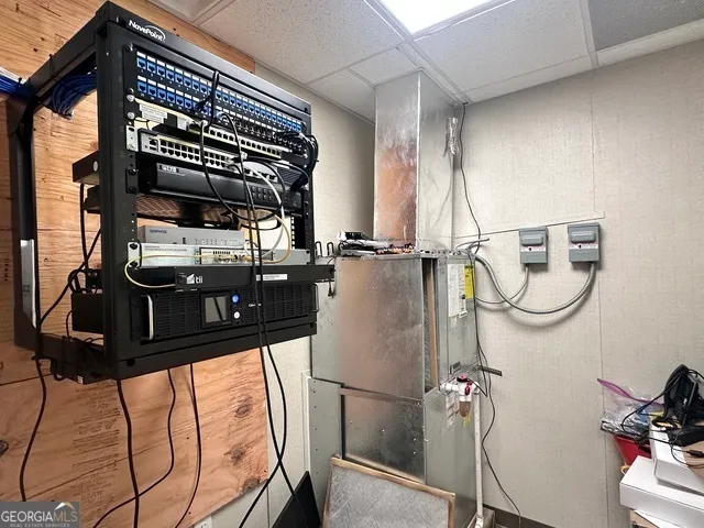 a picture of a room with wooden floor and windows