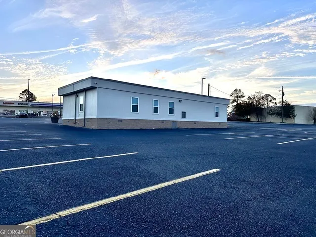 a view of a big room with wooden fence