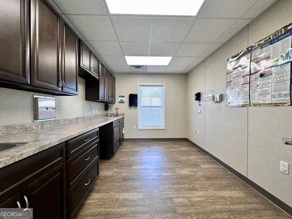 a modern kitchen with stainless steel appliances granite countertop a stove sink and cabinets