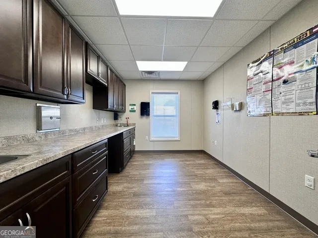 a modern kitchen with stainless steel appliances granite countertop a stove sink and cabinets