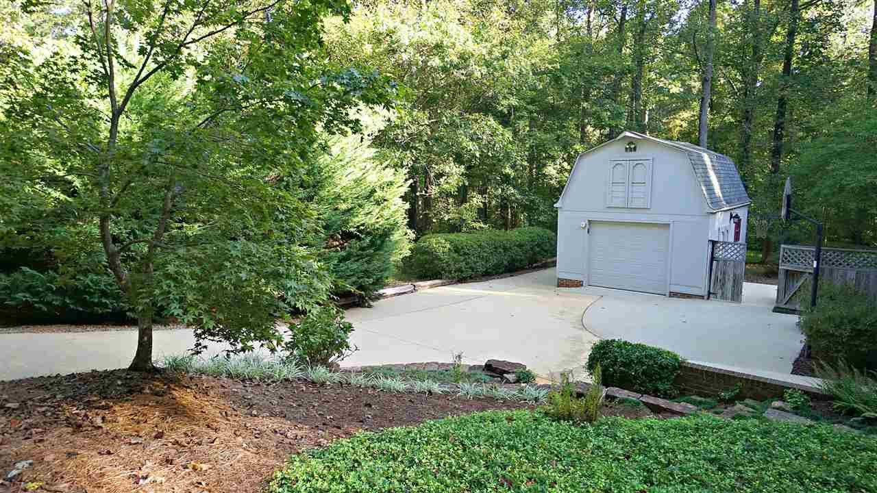 5113 Forest Creek Road Raleigh, NC 27606 - Photo 24 of 30 4th car garage or detached workshop-storage area above. Private parking pad off to the side Garage