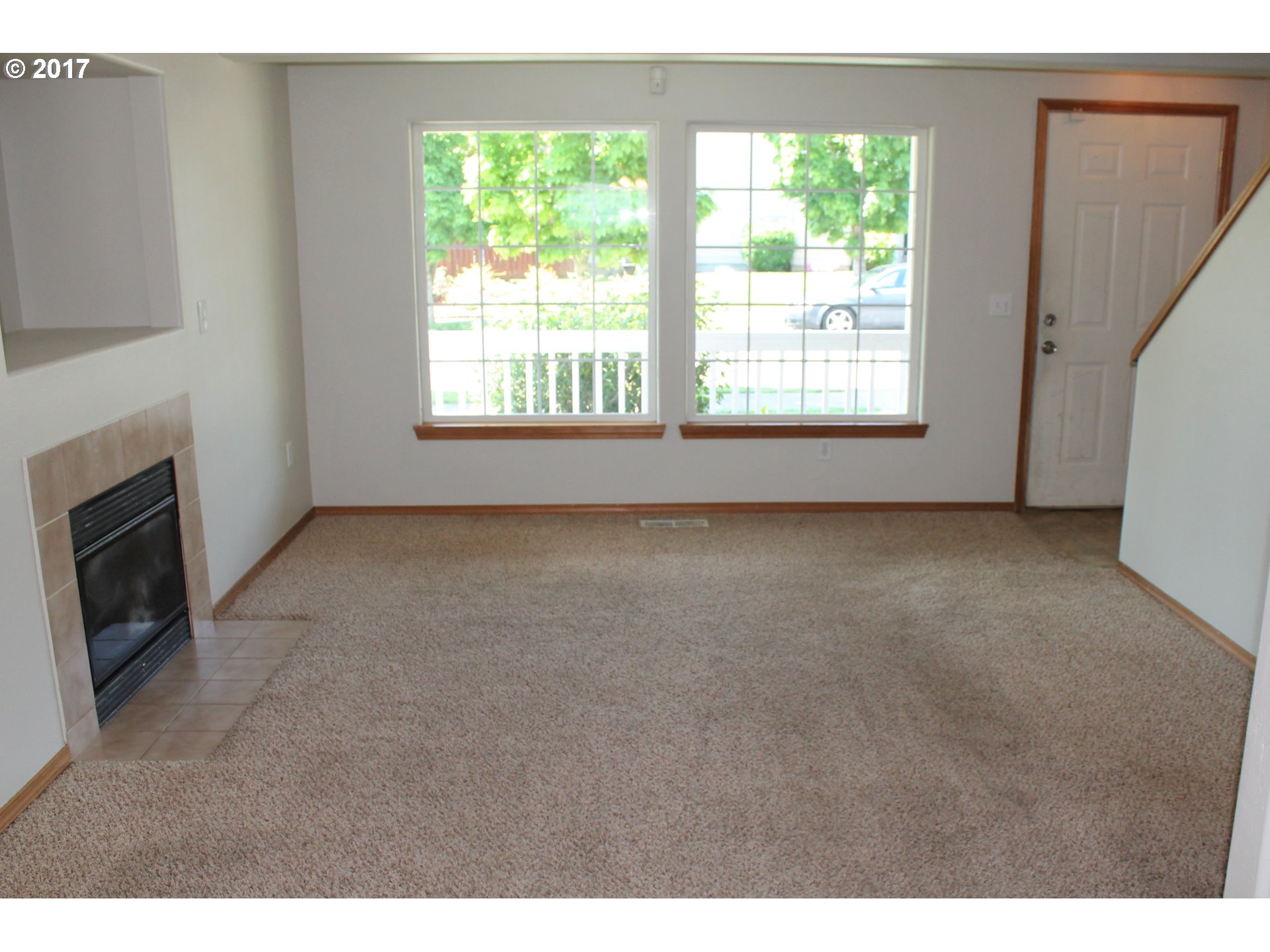 1026 Southwest Ivory Loop Gresham, OR 97080 - Photo 5 of 13 a view of a livingroom with an empty space and a fireplace