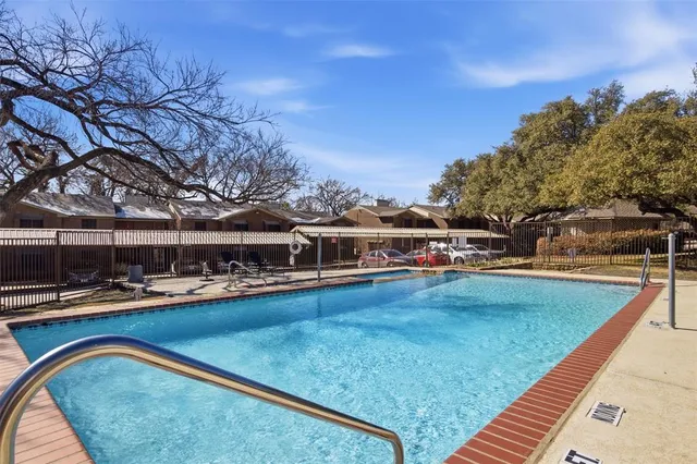 a view of a swimming pool with lounge chair