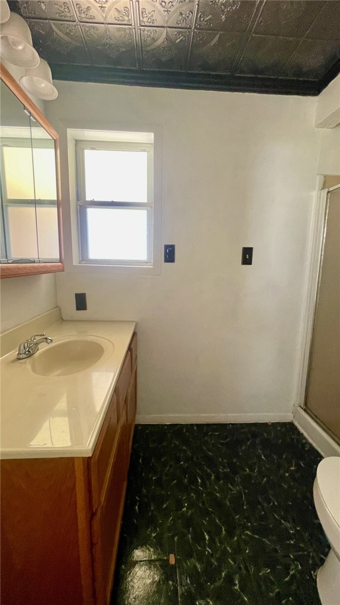 10933 Clyde Acord Road Franklin, TX 77856 - Photo 10 of 20 a bathroom with a sink and a toilet