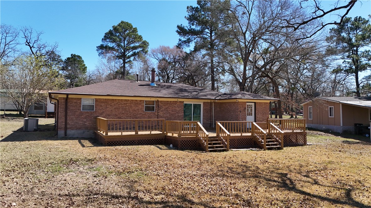 10933 Clyde Acord Road Franklin, TX 77856 - Photo 14 of 20 a front view of a house with a yard and garage