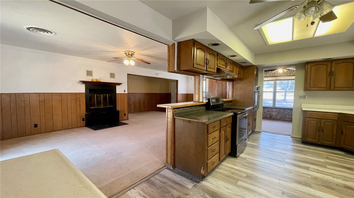 10933 Clyde Acord Road Franklin, TX 77856 - Photo 20 of 20 a kitchen with stainless steel appliances granite countertop a stove a sink and a refrigerator