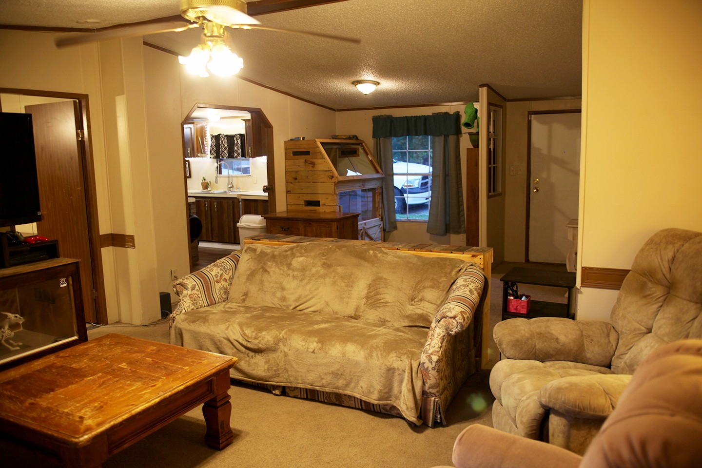 210 Maple Street Adams, TN 37010 - Photo 17 of 35 a bed room with a bed and a television