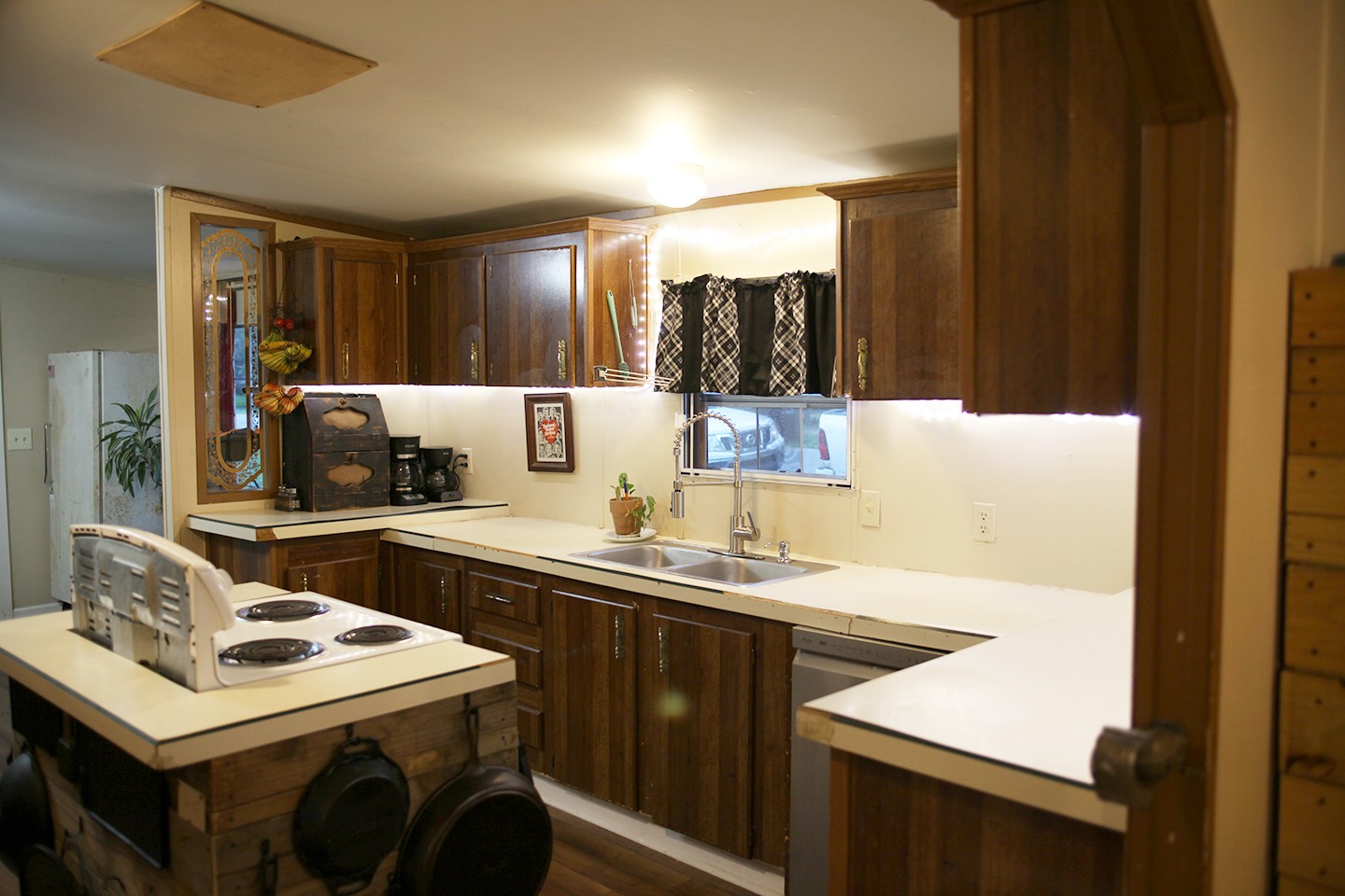 210 Maple Street Adams, TN 37010 - Photo 7 of 35 a kitchen with a sink a stove and a refrigerator