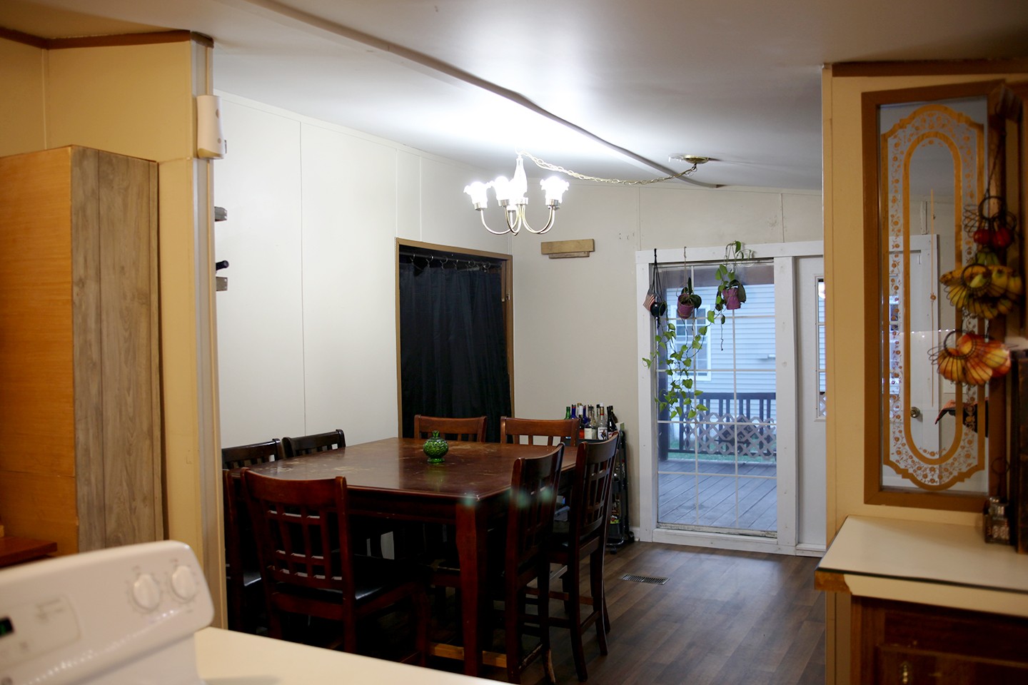 210 Maple Street Adams, TN 37010 - Photo 9 of 35 a view of a dining room with furniture and wooden floor