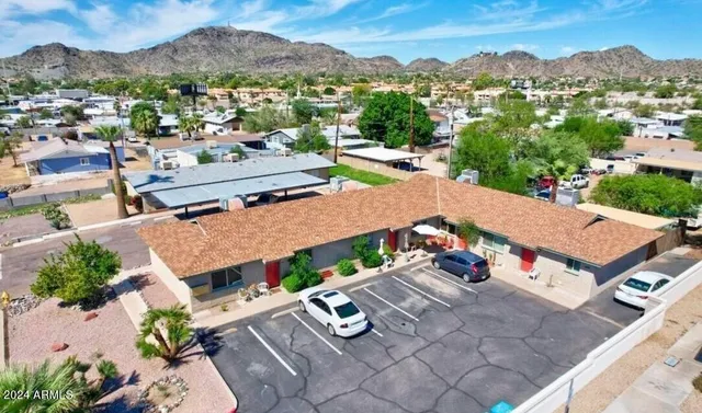 an aerial view of residential houses with outdoor space