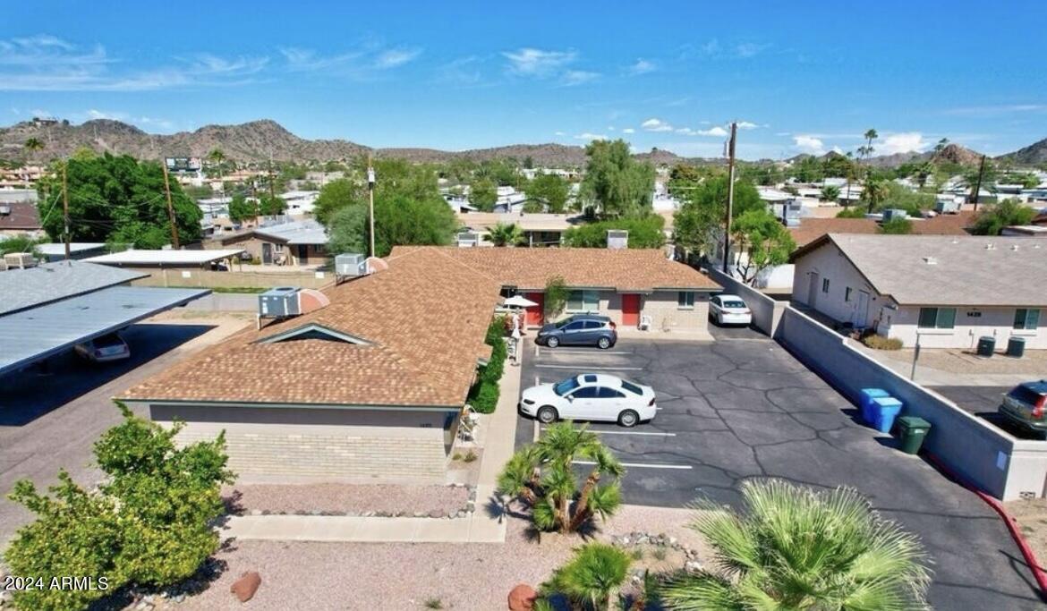 1420 East Brown Street, Unit D Phoenix, AZ 85020 - Photo 2 of 11 a view of a houses with a yard and a garden