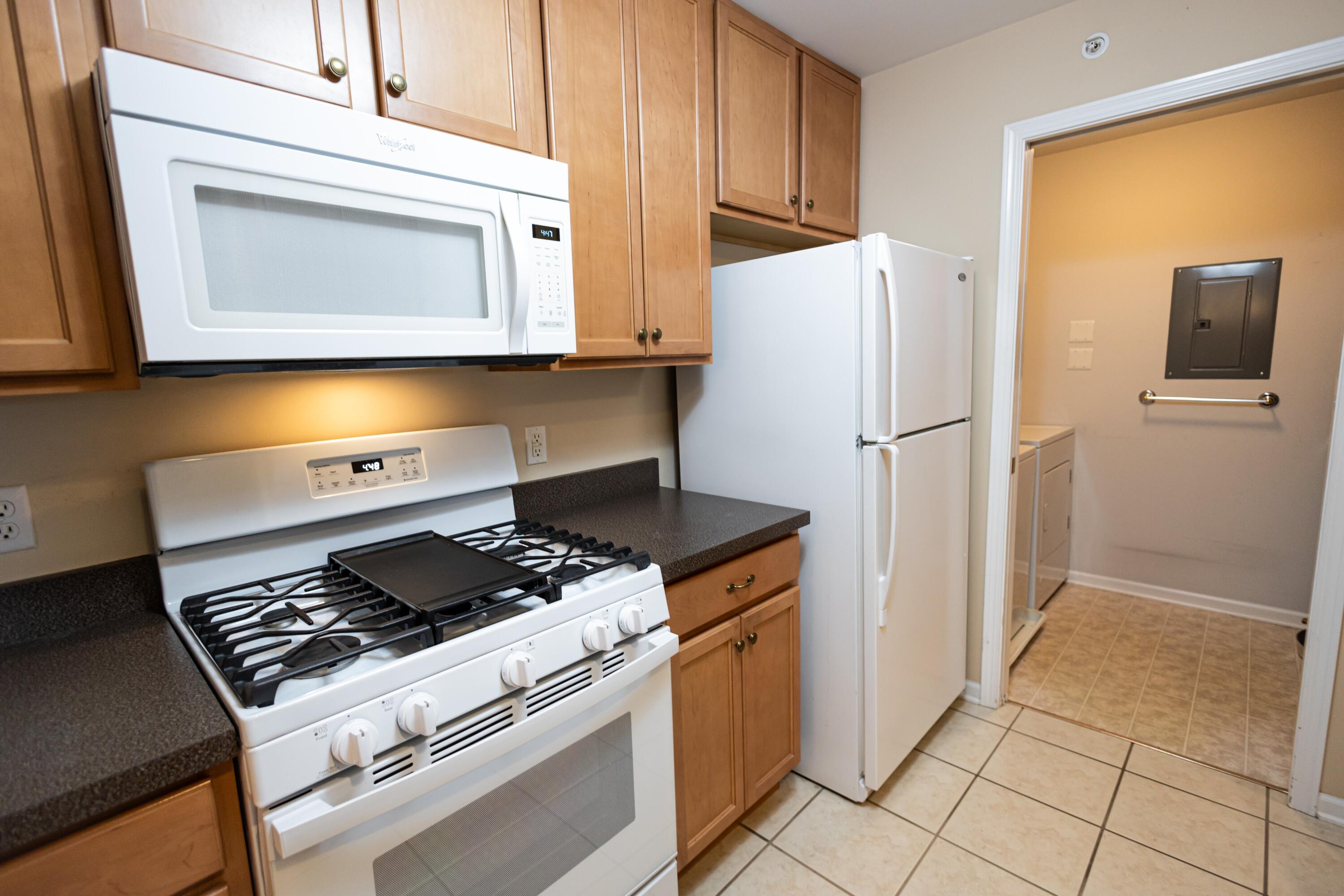 1608 White Oak Circle, Unit 2A Munster, IN 46321 - Photo 12 of 37 a kitchen with a stove and a refrigerator