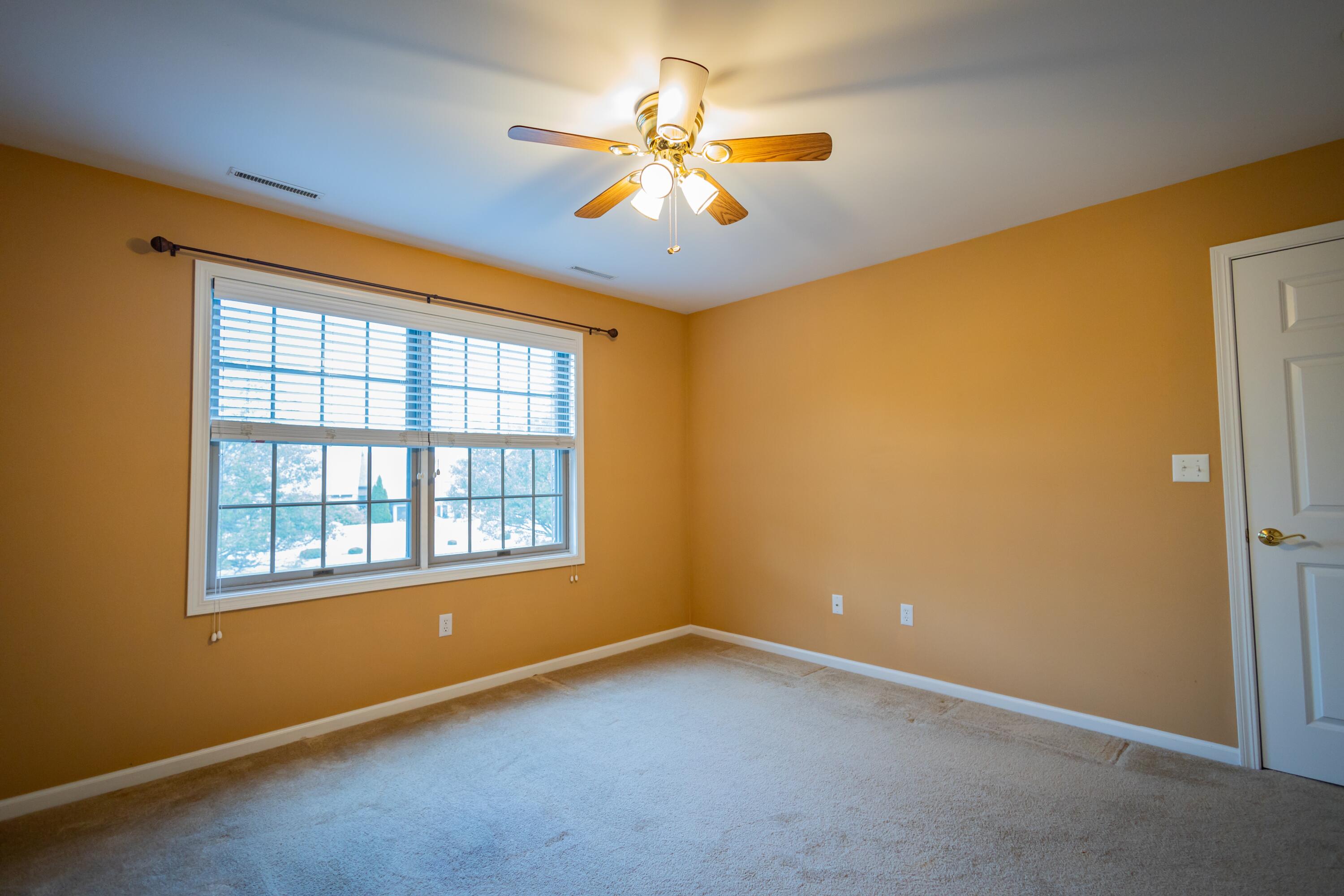 1608 White Oak Circle, Unit 2A Munster, IN 46321 - Photo 22 of 37 an empty room with a window and a ceiling fan
