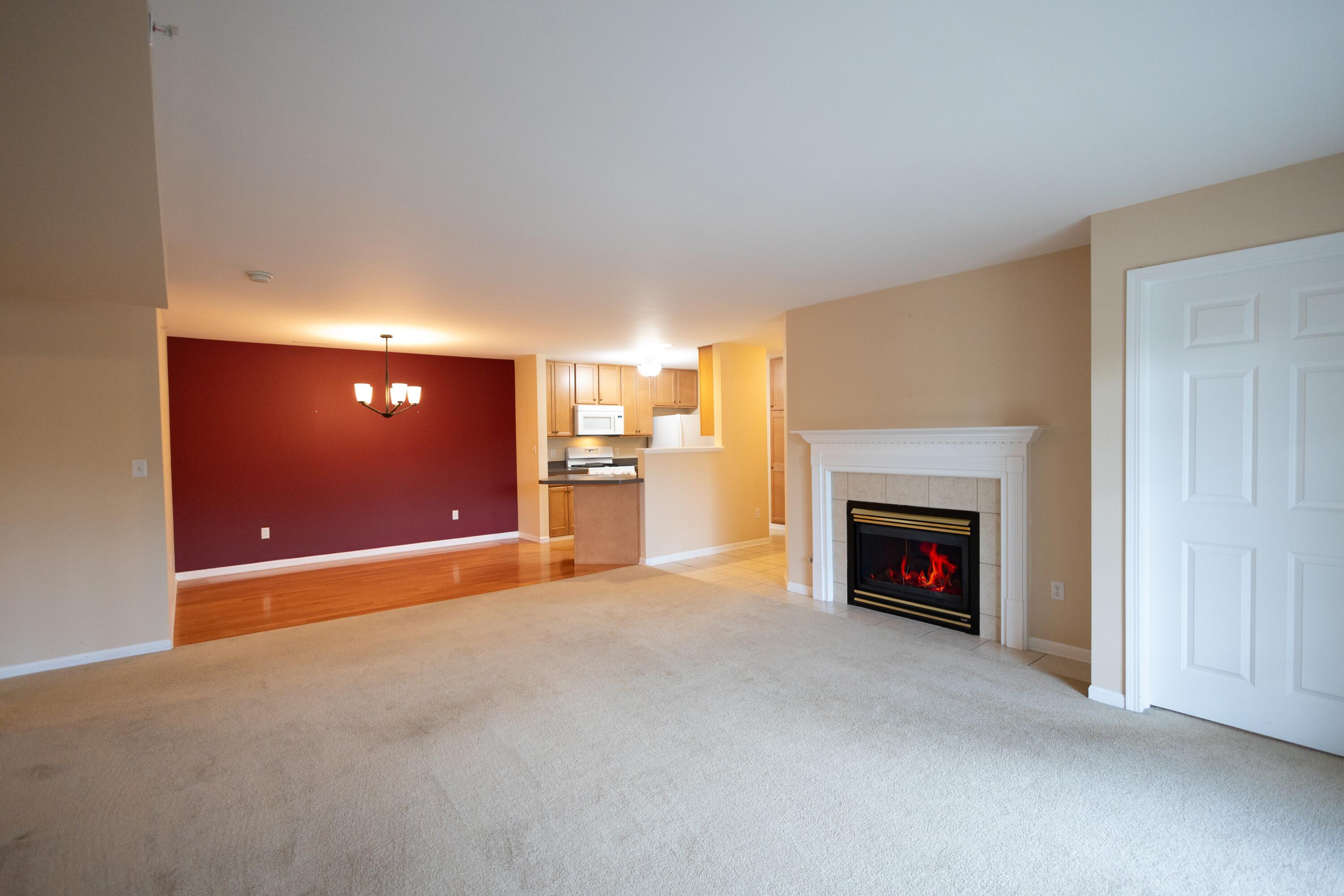 1608 White Oak Circle, Unit 2A Munster, IN 46321 - Photo 8 of 37 a view of empty room with a fireplace