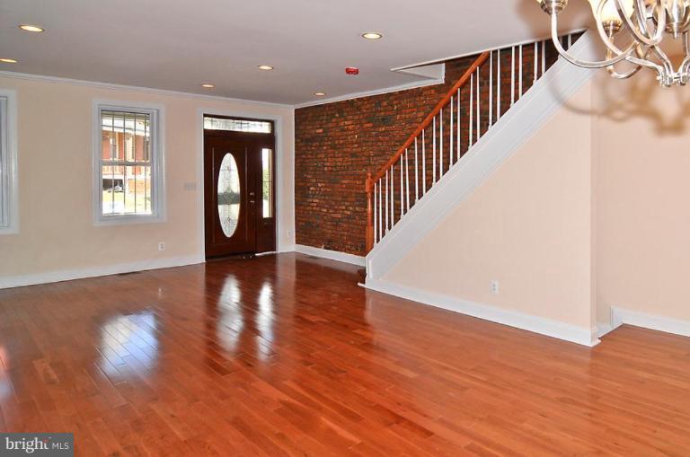 514 Park Road Northwest Washington, DC 20010 - Photo 3 of 15 a hallway with wooden floor and windows
