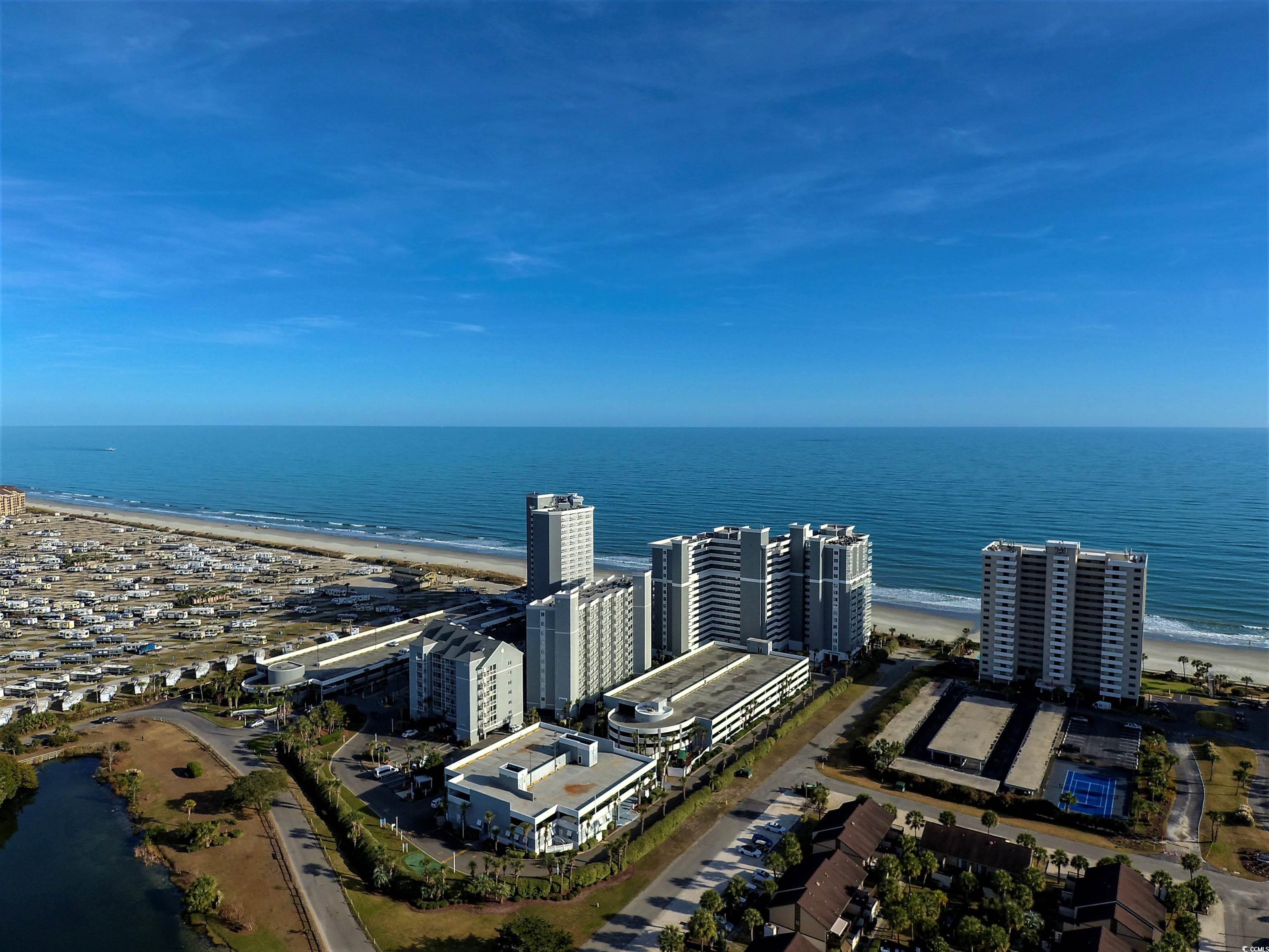 Drone / aerial view of waterfront with a beach