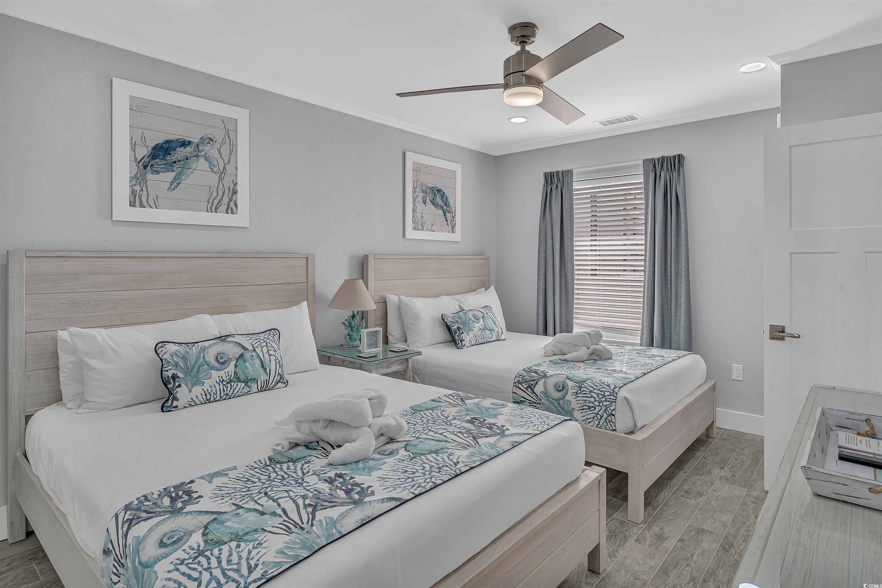 161 Seawatch Drive, Unit 1118 Myrtle Beach, SC 29572 - Photo 12 of 40 Bedroom with wood finish floors, ceiling fan, recessed lighting, and crown molding