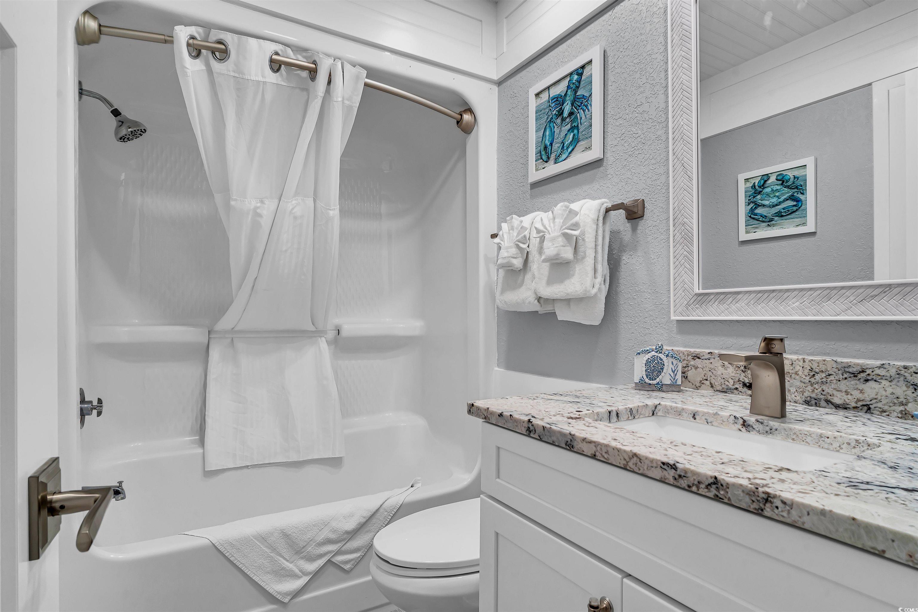 161 Seawatch Drive, Unit 1118 Myrtle Beach, SC 29572 - Photo 14 of 40 Full bath featuring shower / bath combo, vanity, and a textured wall