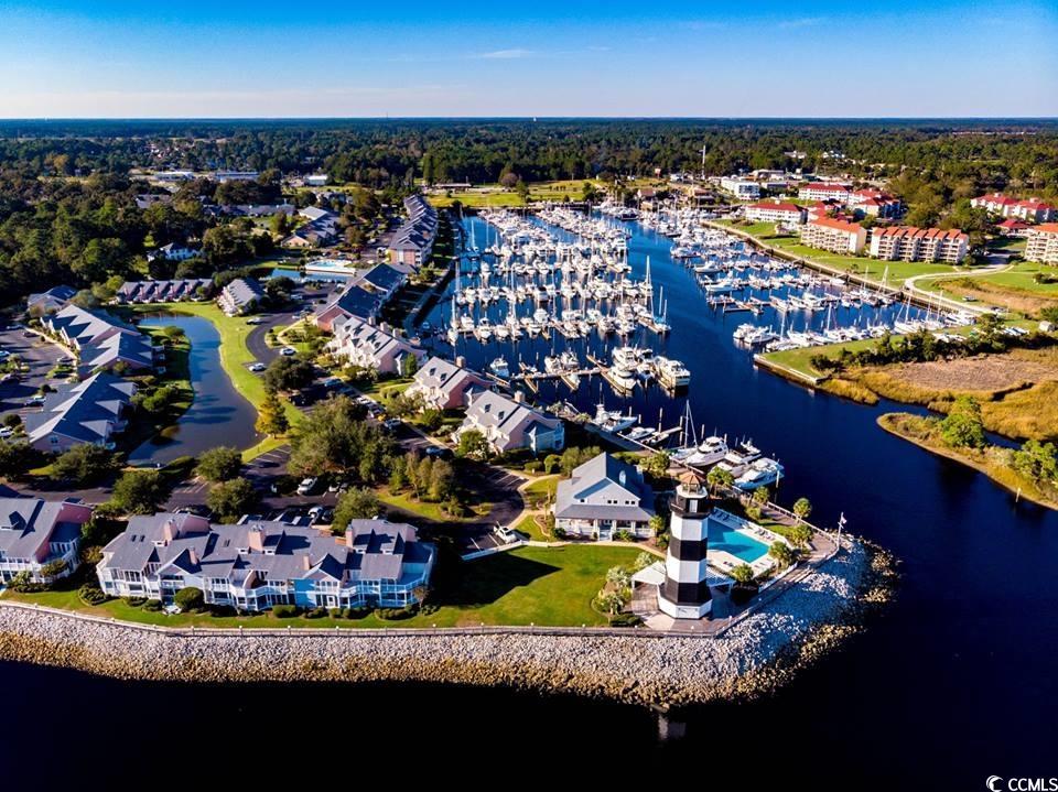161 Seawatch Drive, Unit 1118 Myrtle Beach, SC 29572 - Photo 36 of 40 Drone / aerial view of numerous boat docks and a large body of water