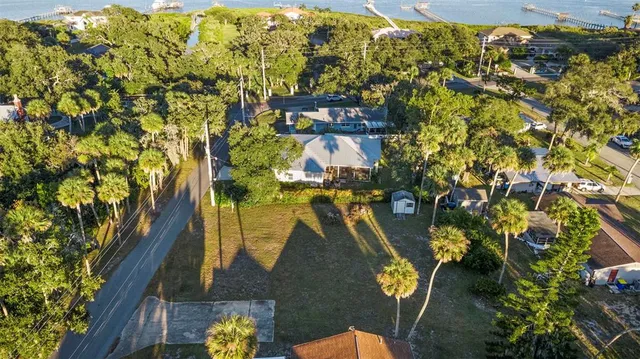 a view of swimming pool with outdoor seating and city view