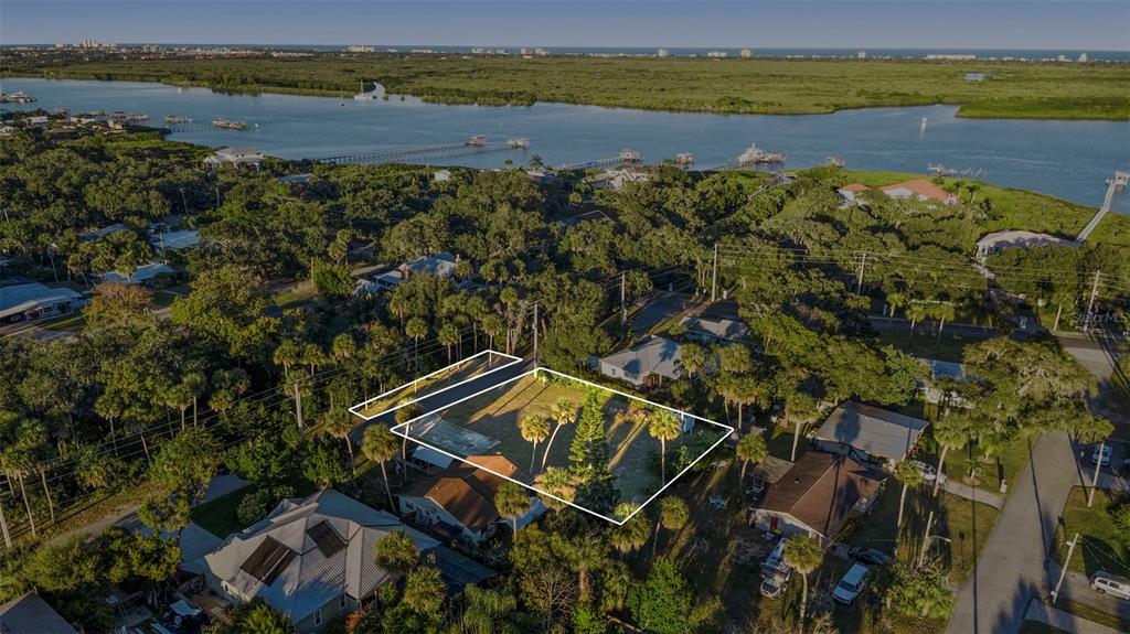 120 Hamilton Road Edgewater, FL 32132 - Photo 2 of 21 a view of a lake with a mountain in the background