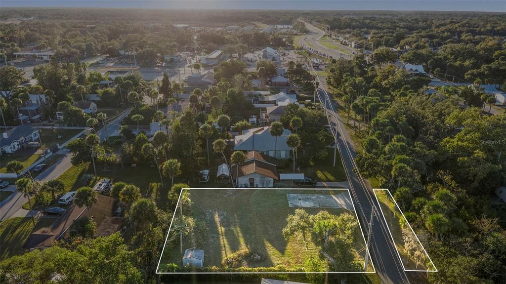 120 Hamilton Road Edgewater, FL 32132 - Photo 4 of 21 an aerial view of a residential houses lake and mountain view