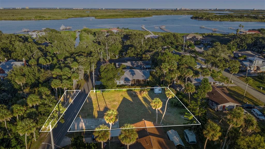 120 Hamilton Road Edgewater, FL 32132 - Photo 5 of 21 a view of a lake with a mountain