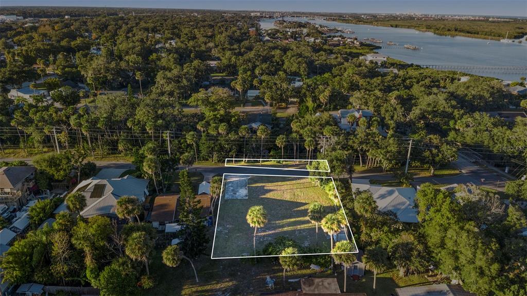 120 Hamilton Road Edgewater, FL 32132 - Photo 6 of 21 view of a lake with lawn chairs