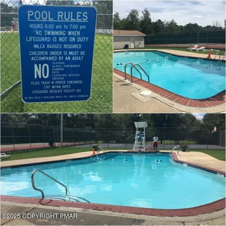 a view of a swimming pool with a yard