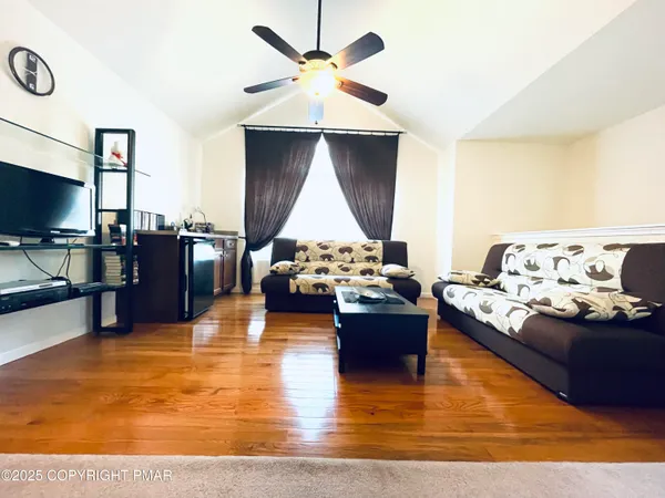 a living room with furniture and a flat screen tv