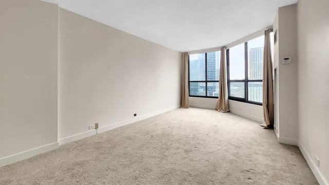 a view of an empty room with a window