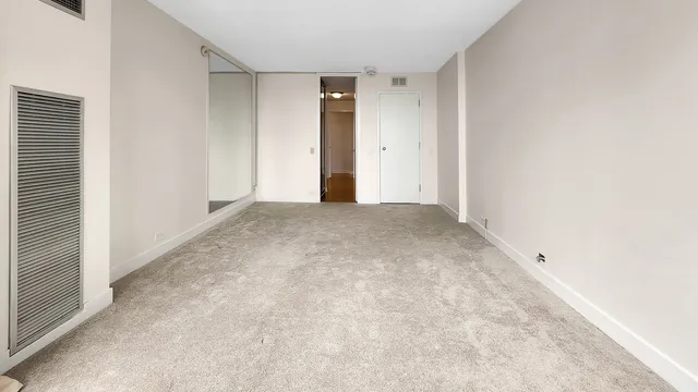 a bed room with a bed and a couch