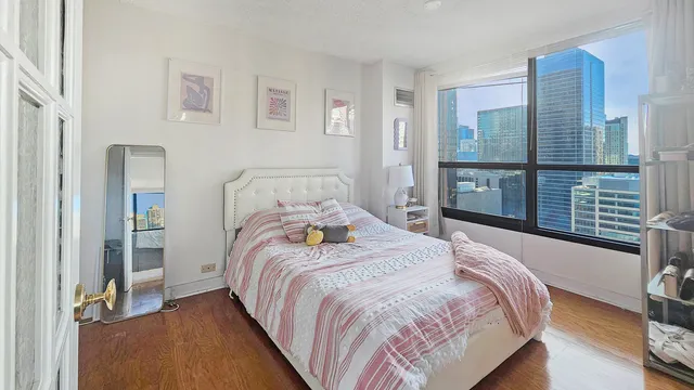 a bedroom with a bed and a view of bedroom