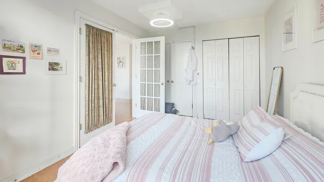 a view of a room with wooden floor