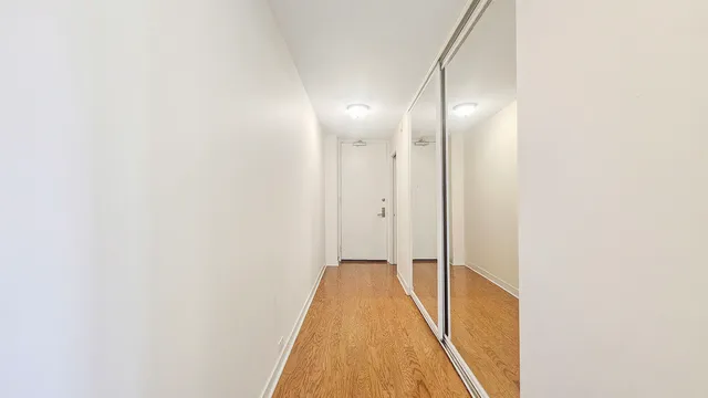 a living room with lots of furniture and white walls