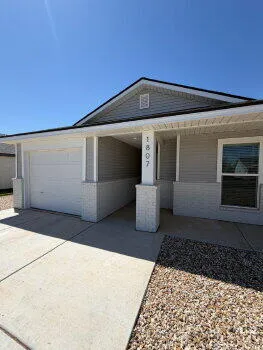a view of a back yard of the house