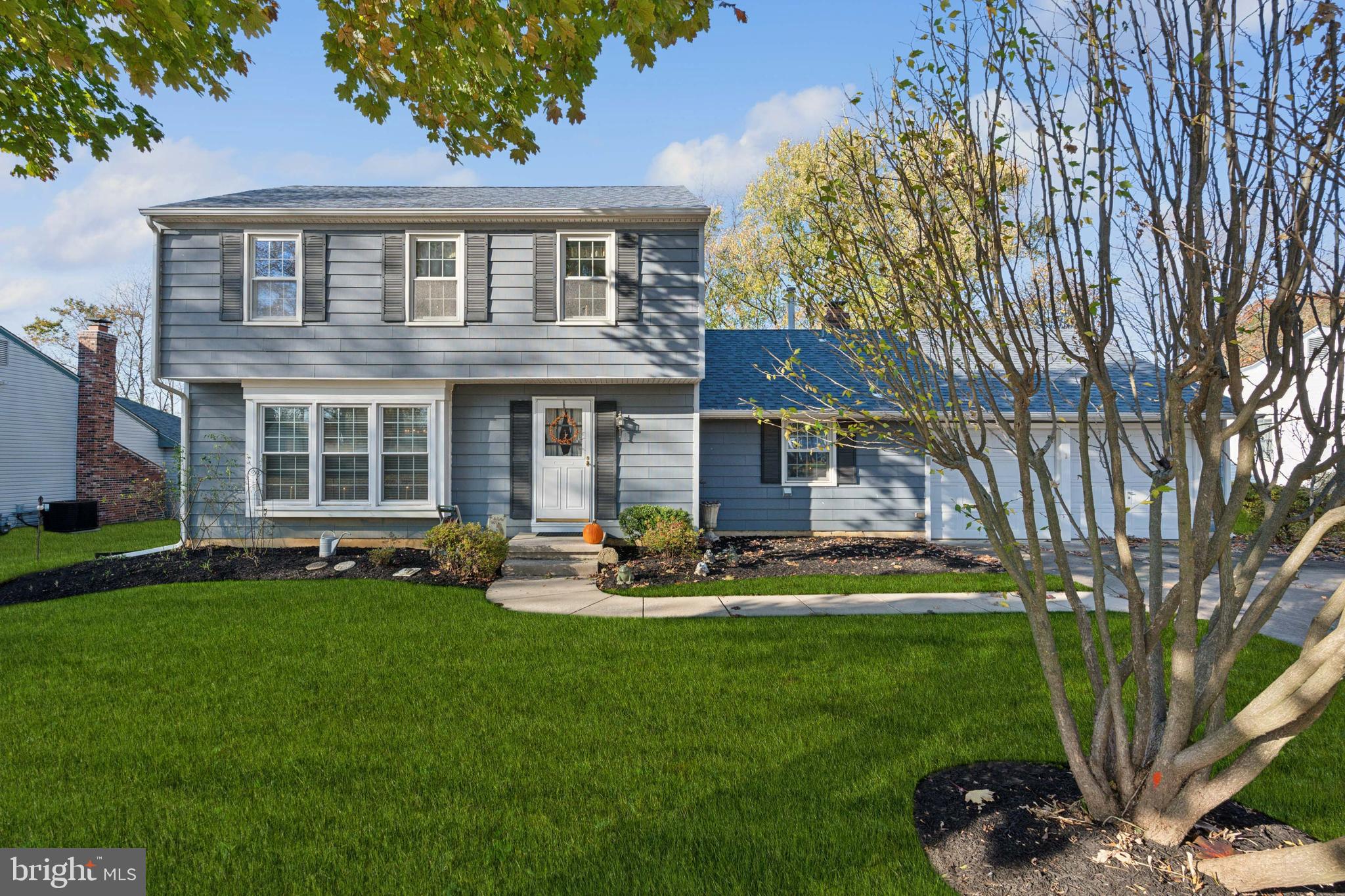 106 Pelham Road Delran, NJ 08075 - Photo 1 of 24 a front view of a house with a garden and yard