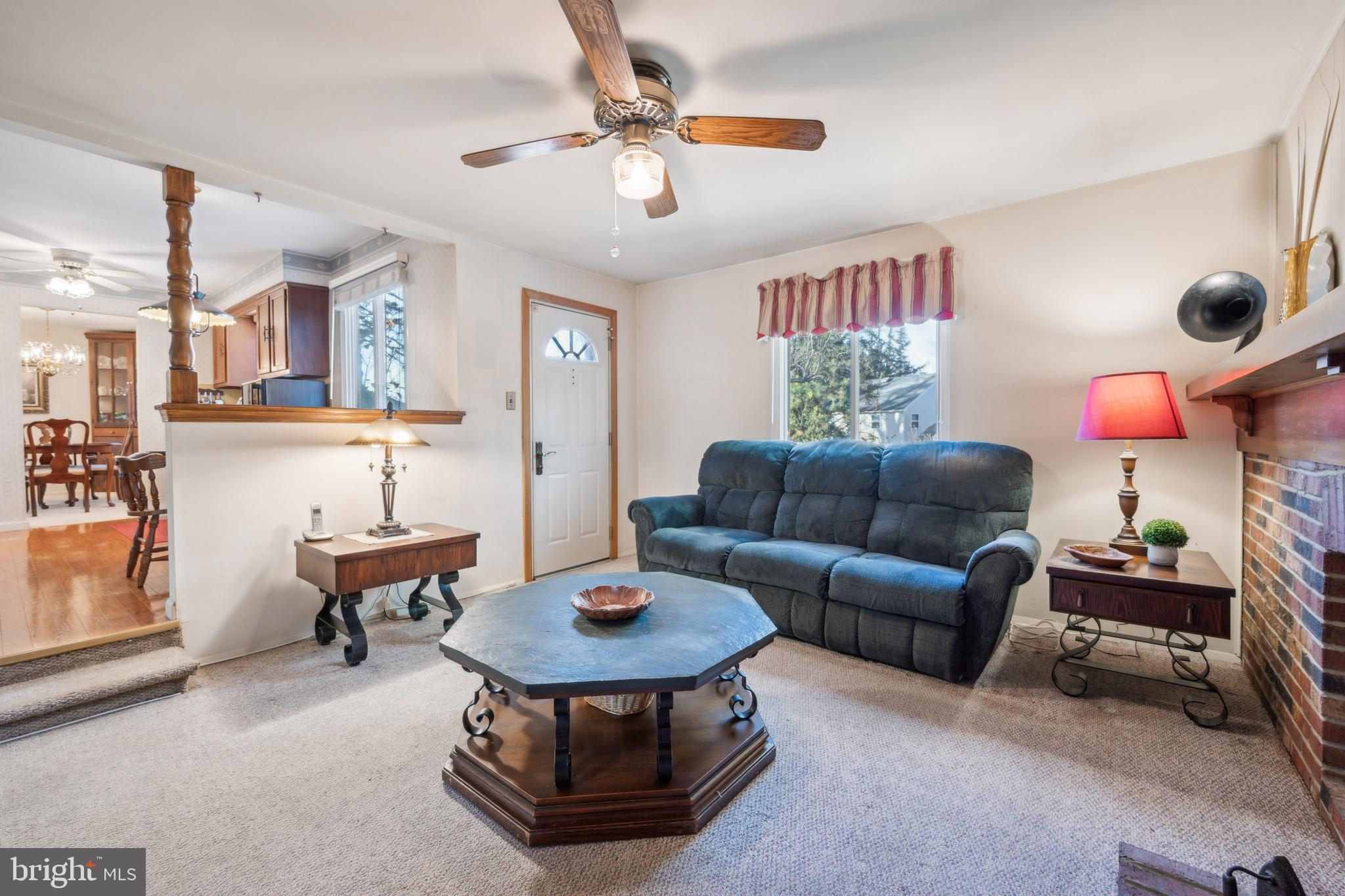 106 Pelham Road Delran, NJ 08075 - Photo 14 of 24 a living room with furniture a chandelier and a dining table