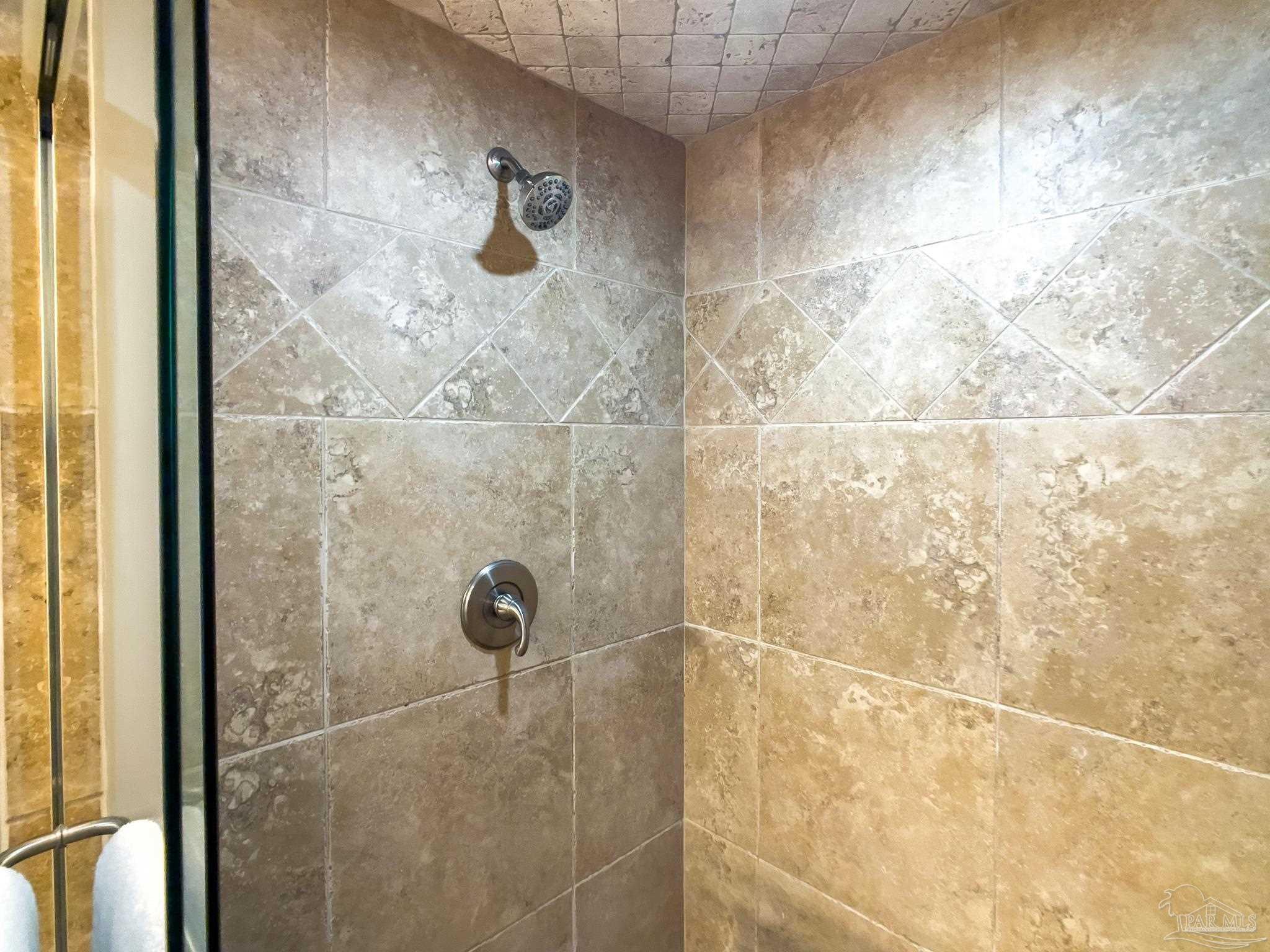 16287 Perdido Key Drive, Unit 104 Pensacola, FL 32507 - Photo 17 of 32 a bathroom with a shower