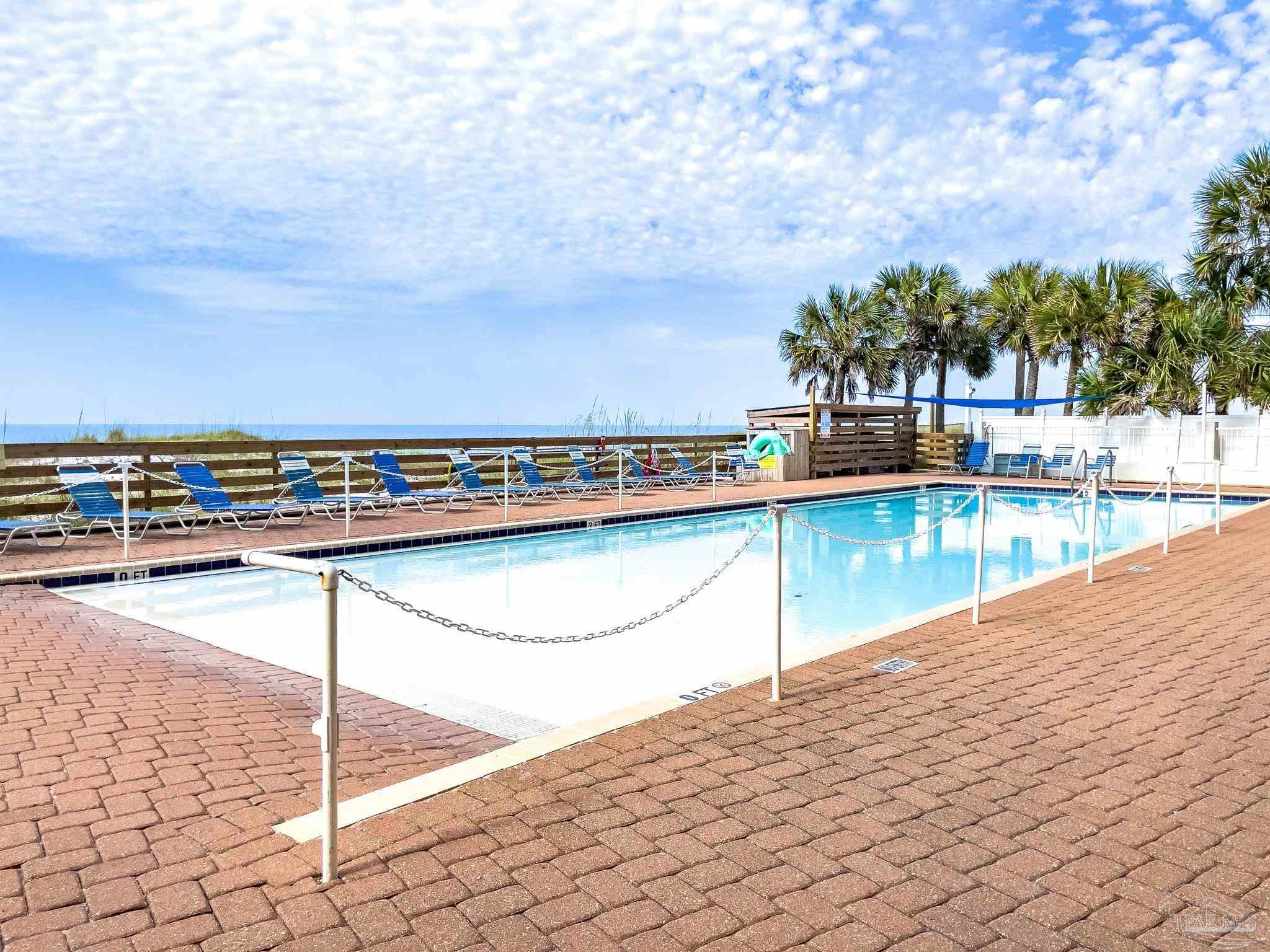 16287 Perdido Key Drive, Unit 104 Pensacola, FL 32507 - Photo 24 of 32 a view of swimming pool with outdoor seating