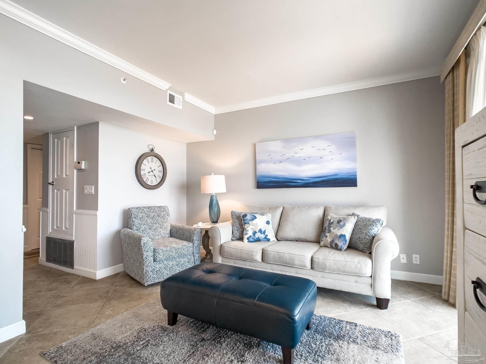 16287 Perdido Key Drive, Unit 104 Pensacola, FL 32507 - Photo 6 of 32 a living room with furniture and a large window