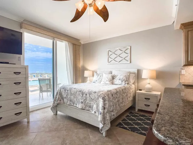 a spacious bedroom with a bed and a window