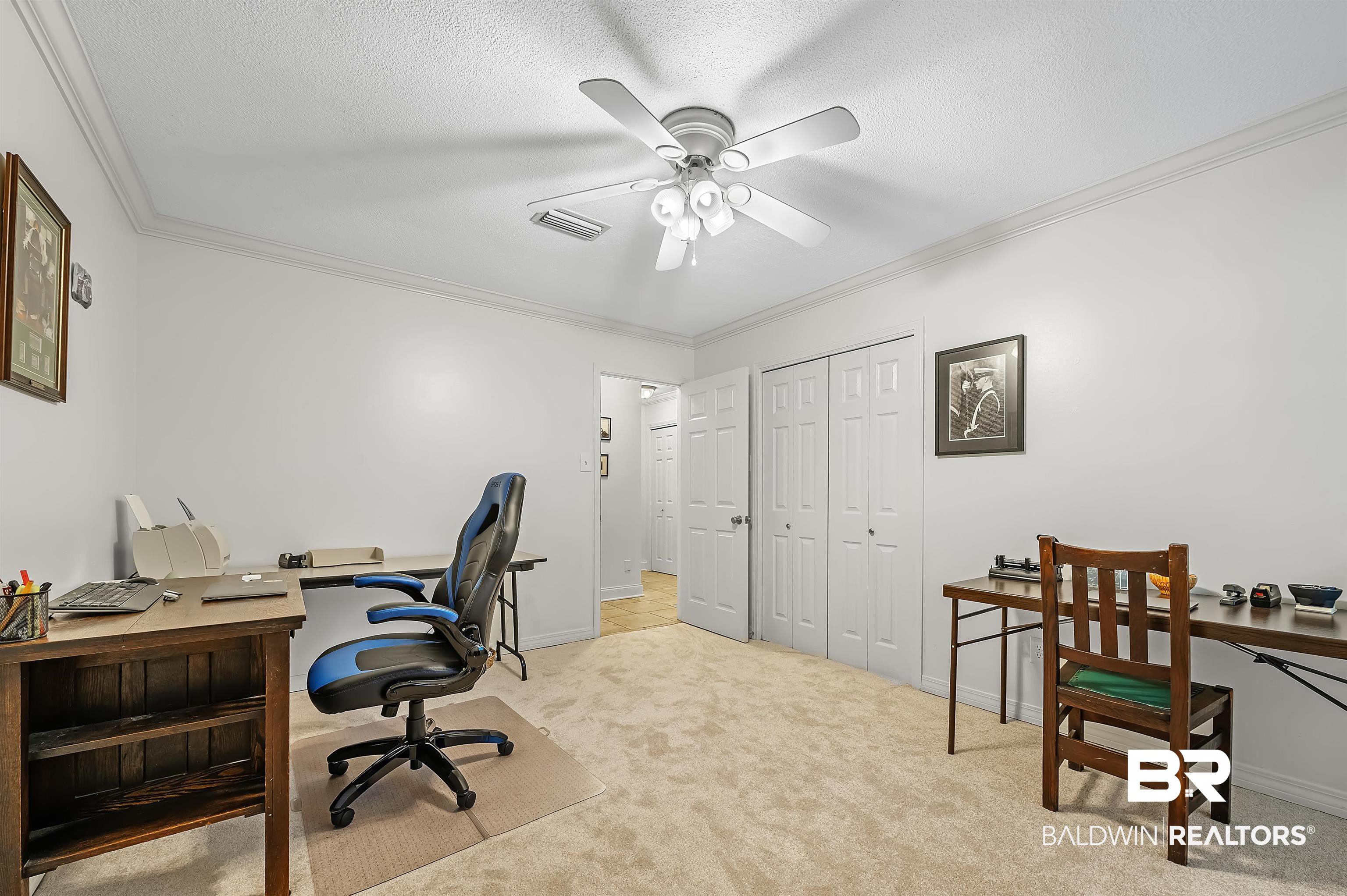104 James Circle Daphne, AL 36526 - Photo 56 of 62 Carpeted office space featuring a textured ceiling, ceiling fan, and ornamental molding