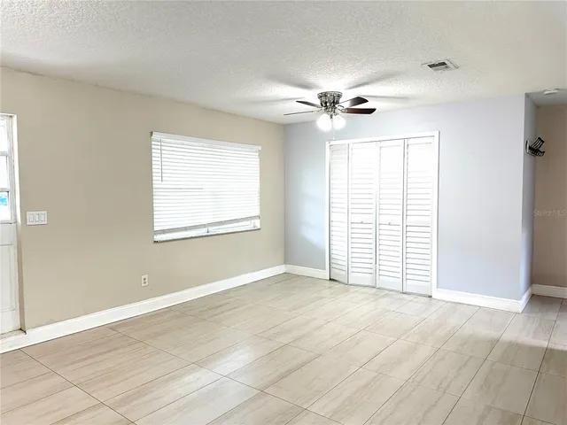 a view of an empty room with a window