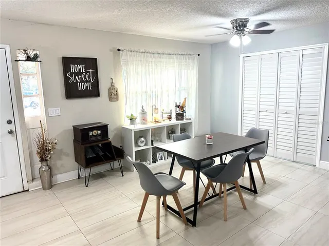 a view of a livingroom with furniture and a window