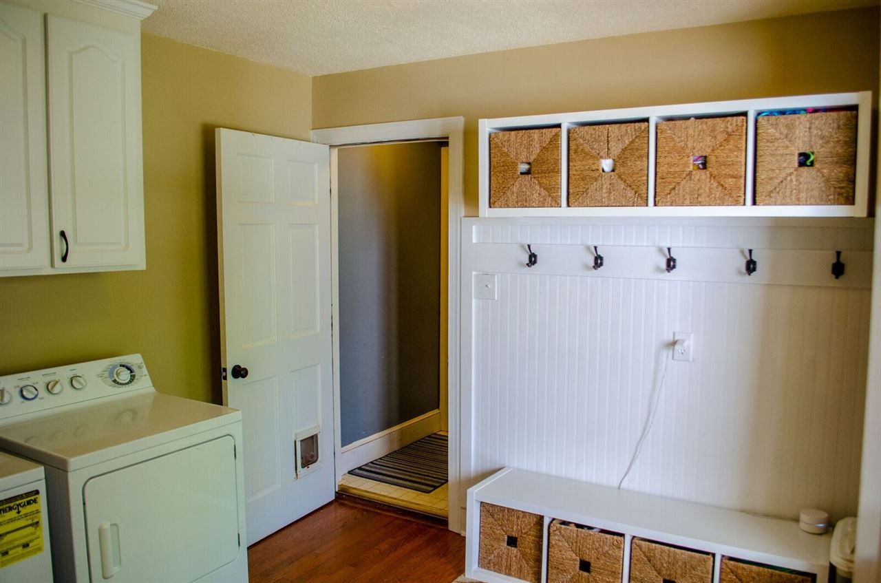 10016 Bushveld Lane Raleigh, NC 27613 - Photo 24 of 24 Spacious laundry room area, with entrance from the side porch. Tons of storage in the nook area, perfect for those messy backpacks, jackets, etc. Laundry room