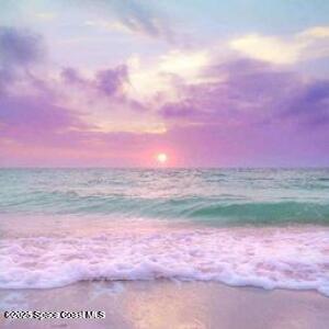 7302 Stuart Avenue Melbourne Beach, FL 32951 - Photo 2 of 2 a view of a lake in front of the house