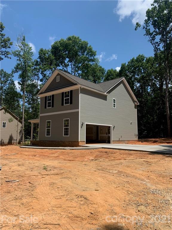 5221 East Lawyers Road Wingate, NC 28174 - Photo 3 of 3 a front view of a house with a yard
