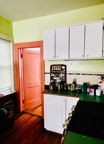 a kitchen with a stove and a microwave