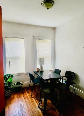 a workspace with furniture and wooden floor